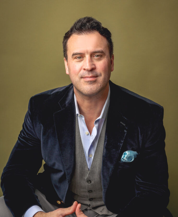 Professional business headshot of Ben Utecht in blazer